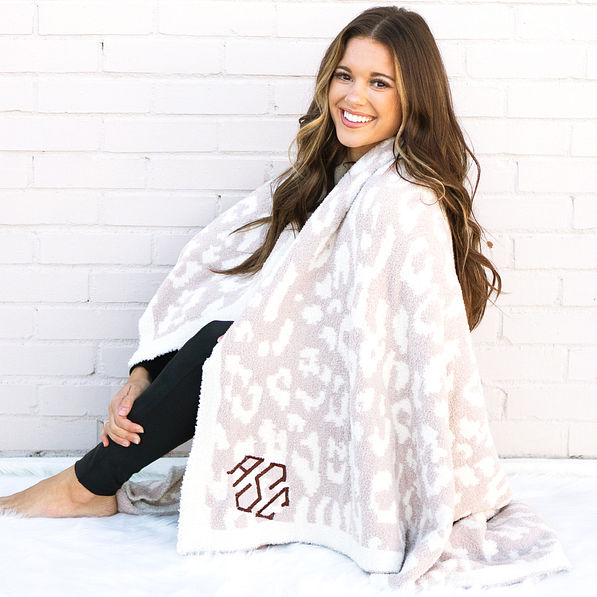 girl wrapped up in personalized cozy blanket