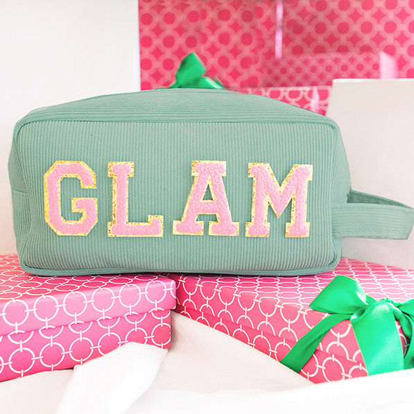 chenille letters in pink and gold on monogrammed corded cosmetic case in aqua