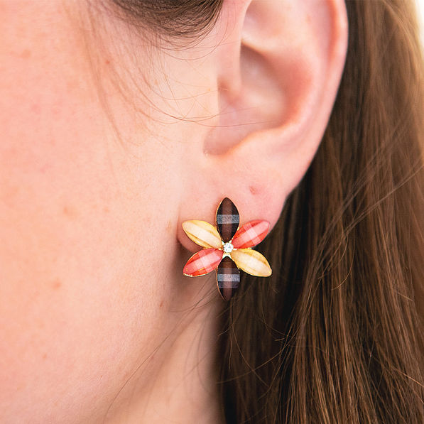 flower stud earring close up in ear