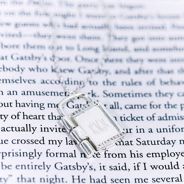 Monogrammed Keepsake Locket closeup on book page
