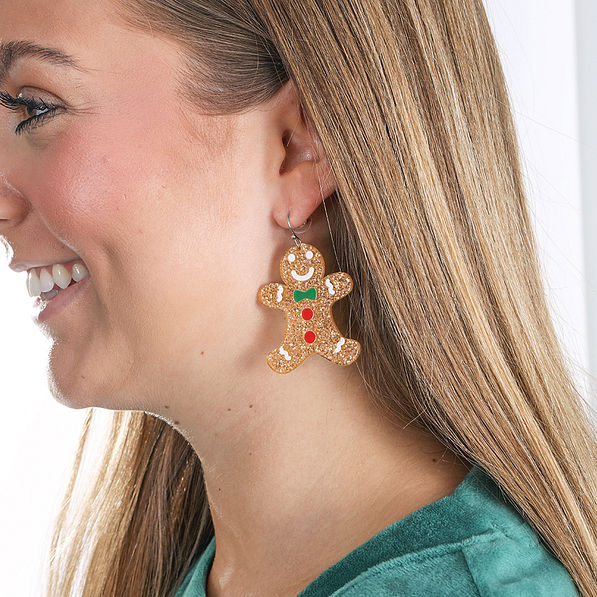 gingerbread man earrings in ears