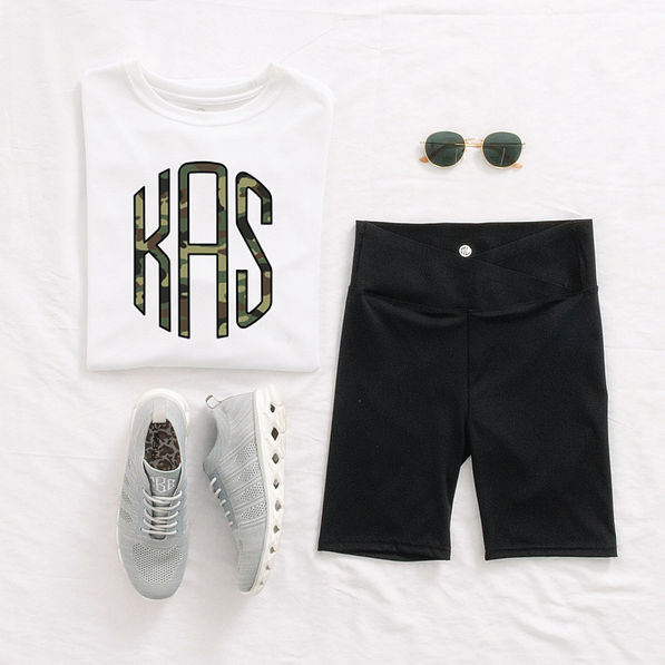 crossover bike shorts outfit on bed with personalized shirt