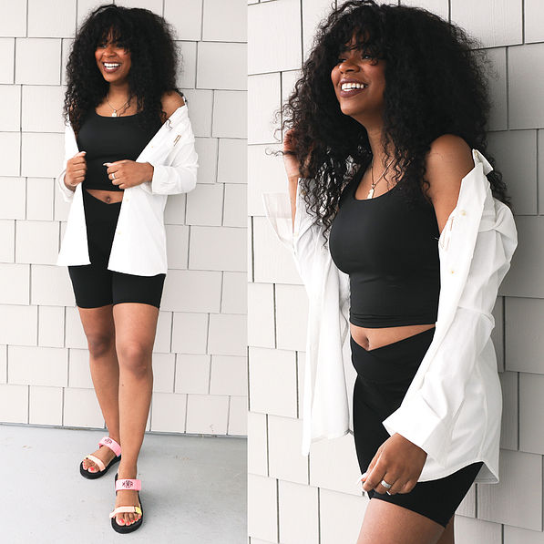 black crossover biker shorts with black tank top and white button down tunic