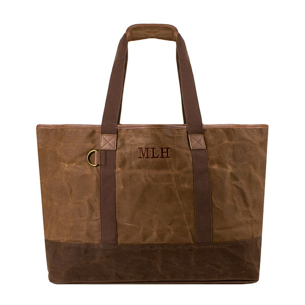 Waxed canvas roll top tote bag with luggage handle attachment
