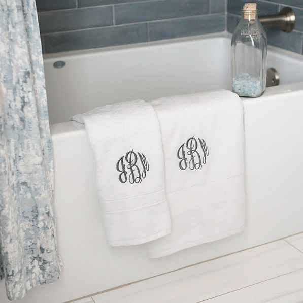 white hand towel with bath towel