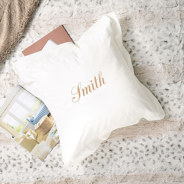 monogrammed white ivory pillow sham with name on blanket
