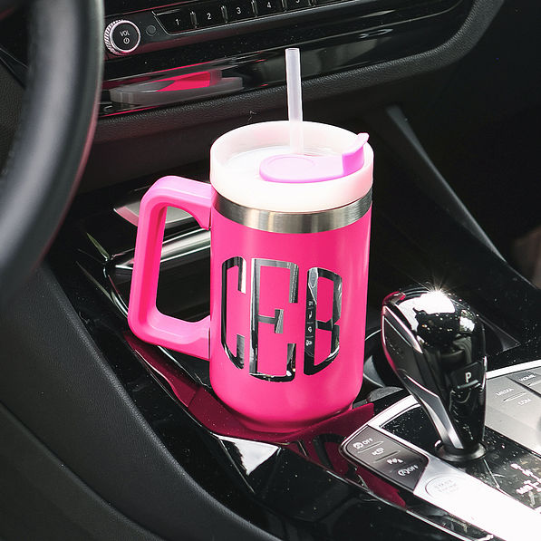 monogrammed hot pink travel tumbler in car