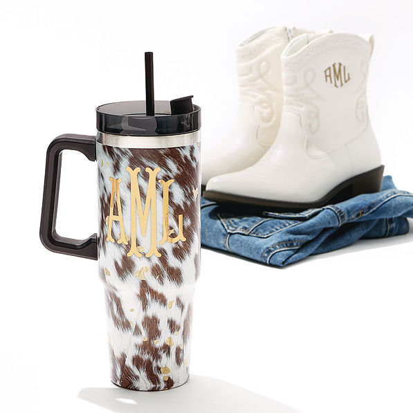 cowhide monogrammed travel tumbler with cowboy boots