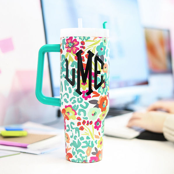 wild blooms travel tumbler on desk