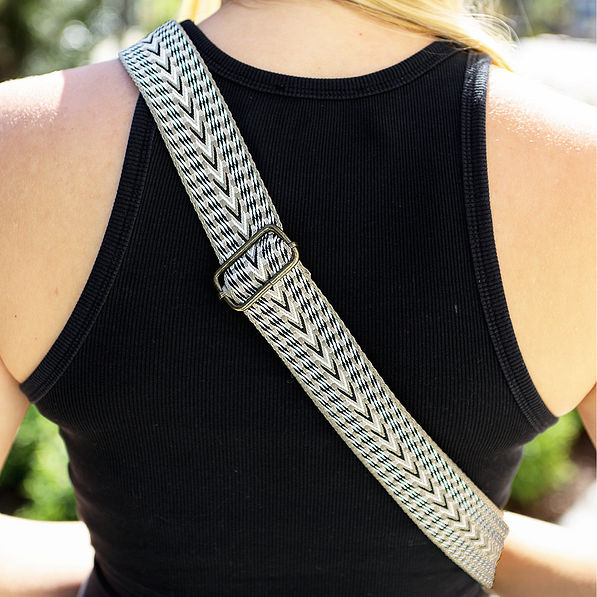detail shot of taupe sling purse strap
