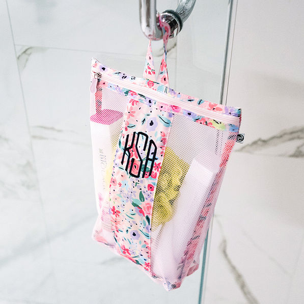 coral floral shower bag hanging in shower