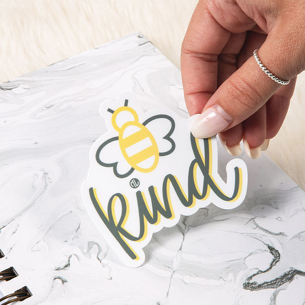 be kind sticker on notebook