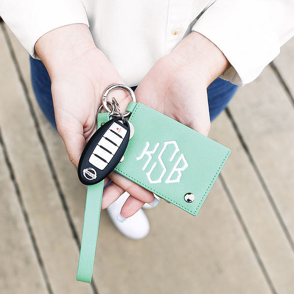 close up of girl holding mint card holder