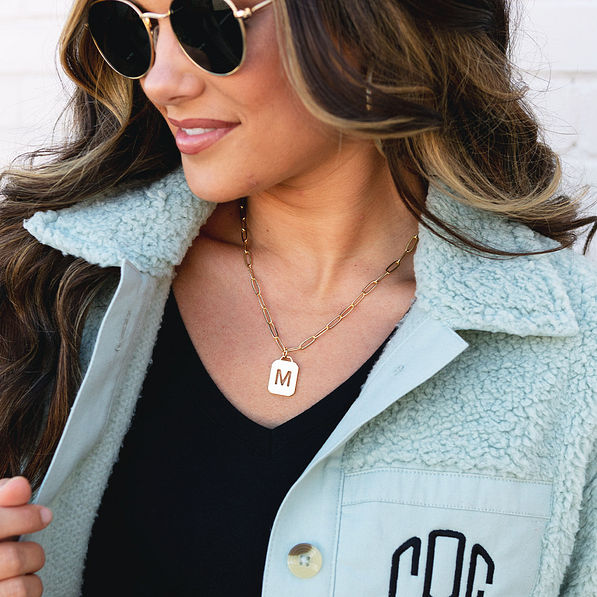 Initial Tag Necklace styled with sherpa shacket and suglasses