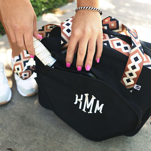 placing paddle in sienna pickleball tote