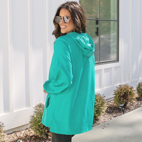 side of monogrammed pullover rain jacket in teal