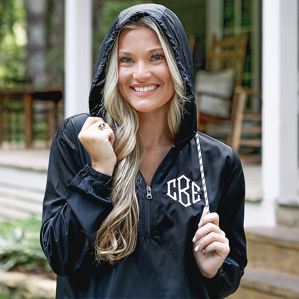 up close of black monogrammed wind breaker