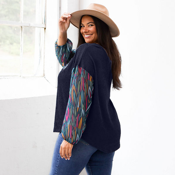 side view of monogrammed puff sleeve top in navy safari