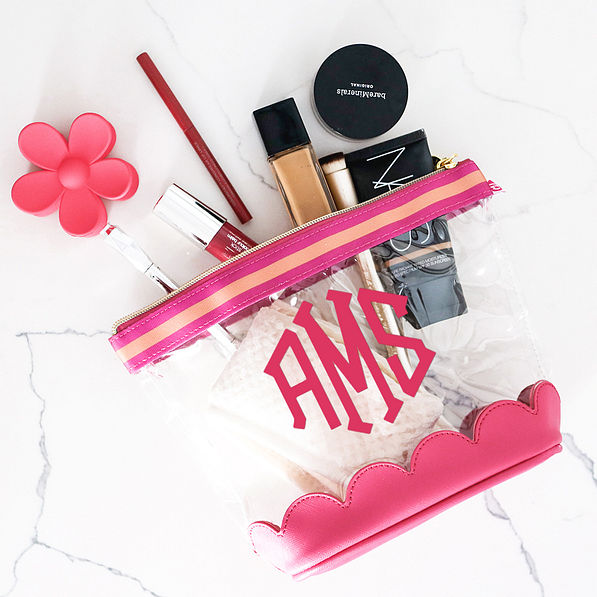 hot pink scalloped cosmetic case flatlay