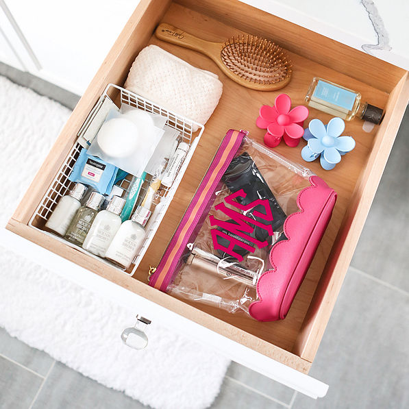 hot pink scalloped cosmetic case in drawer