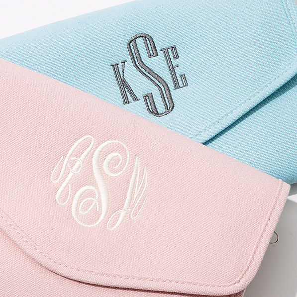 light pink and light blue monogrammed travel jewelry organizers up close