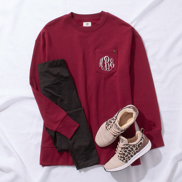 crimson crewneck outfit styled with leggings and leopard sneakers new white monogram