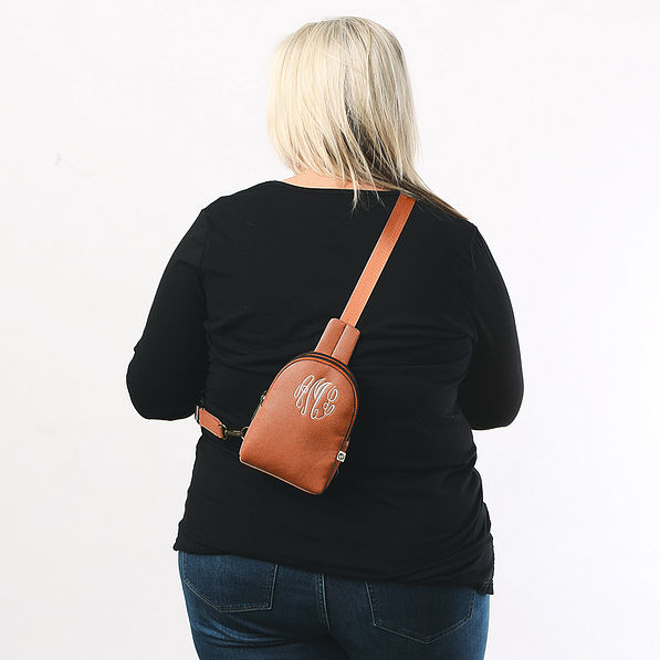 brown sling bag on plus size model