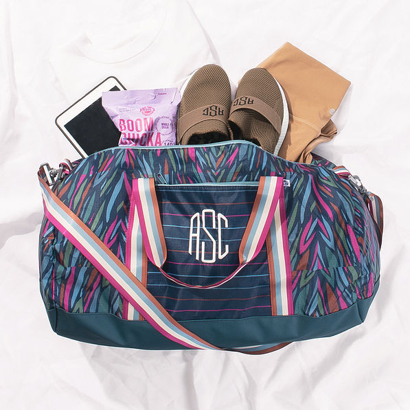 spill shot of navy safari packable travel bag