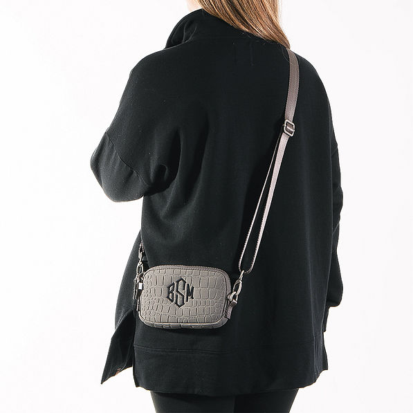 model wearing textured phone crossbody