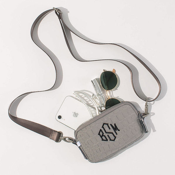 spill shot of taupe textured phone crossbody