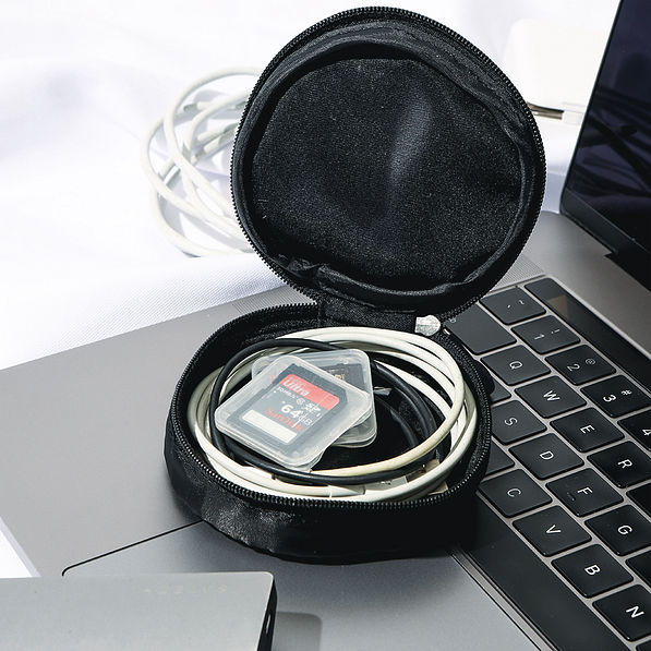 inside of black monogrammed jewelry travel case