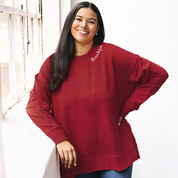 burgundy thankful sweatshirt on julia in studio