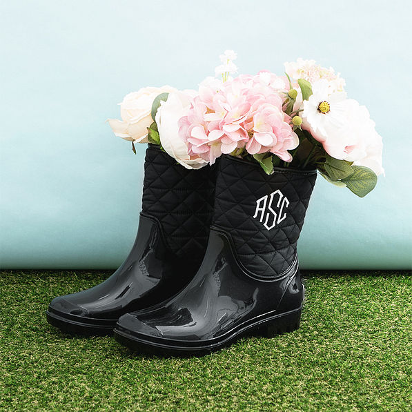 black rain boots with flowers inside