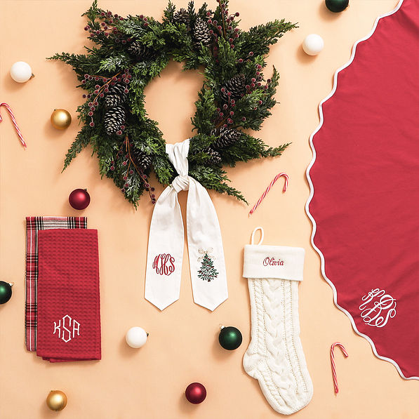 red tree skirt on tan background with christmas collection