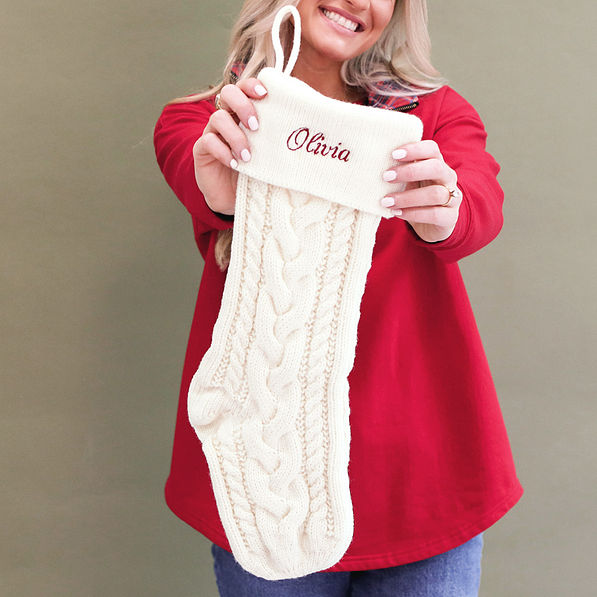 ivory christmas stocking in hands