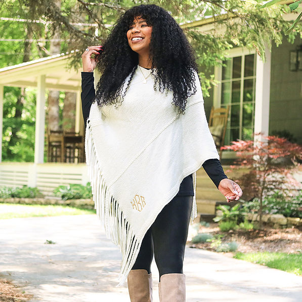 Model wearing Ivory Fringe Poncho