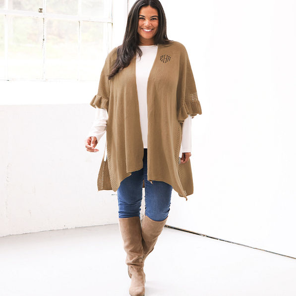 camel monogrammed poncho cardigan with riding boots