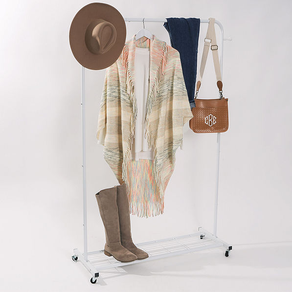 khaki fringe cardigan on dressing rack