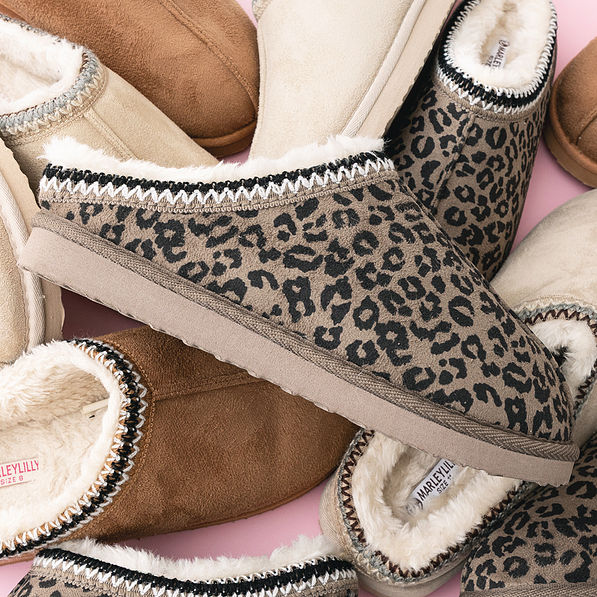 close up of hickory leopard print and light tan moccasins