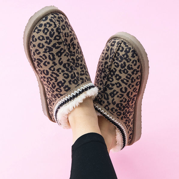 girl wearing leopard print moccasins
