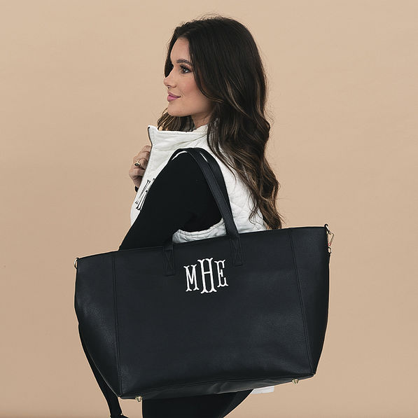 girl carrying Monogrammed Carry On Travel Tote in black
