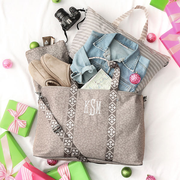 tonal taupe leopard travel bag set flatlay with gift boxes