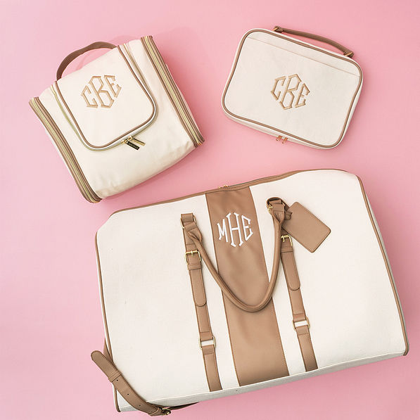 ivory monogrammed hanging toiletry and cosmetic and weekender bags