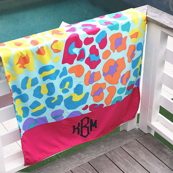 leopard luau personalized beach towel on railing