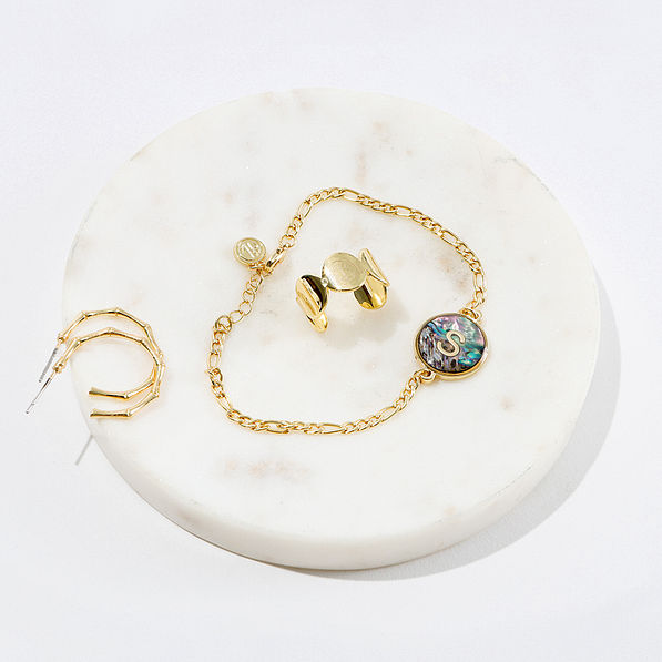 initial bracelet on marble dish