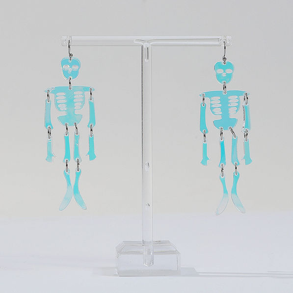 skeleton earrings on stand