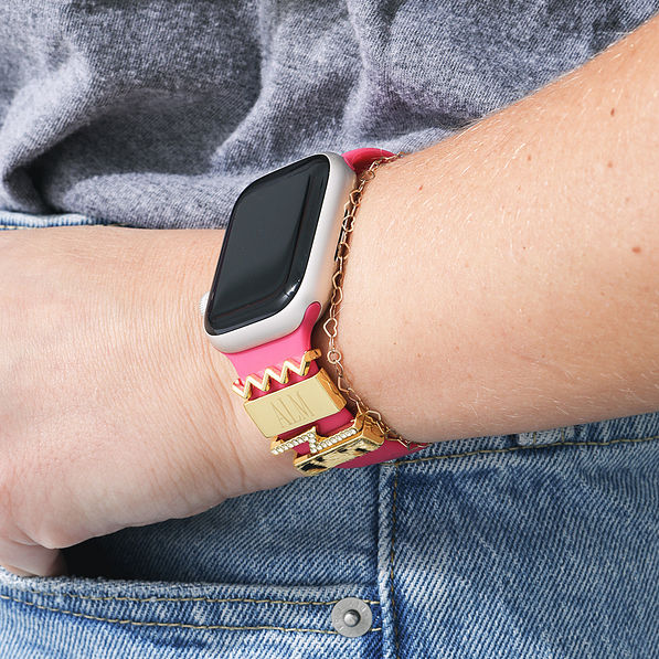 hot pink band and apple watch charms in gold leopard