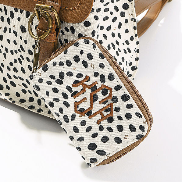 close up of white leopard keychain wallet