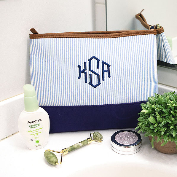 monogrammed seersucker cosmetic bag on sink