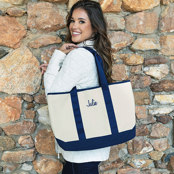 girl with navy personalized boat tote bag over shoulder